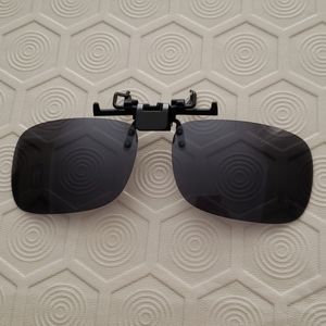 Flip-up solar shield for glasses.